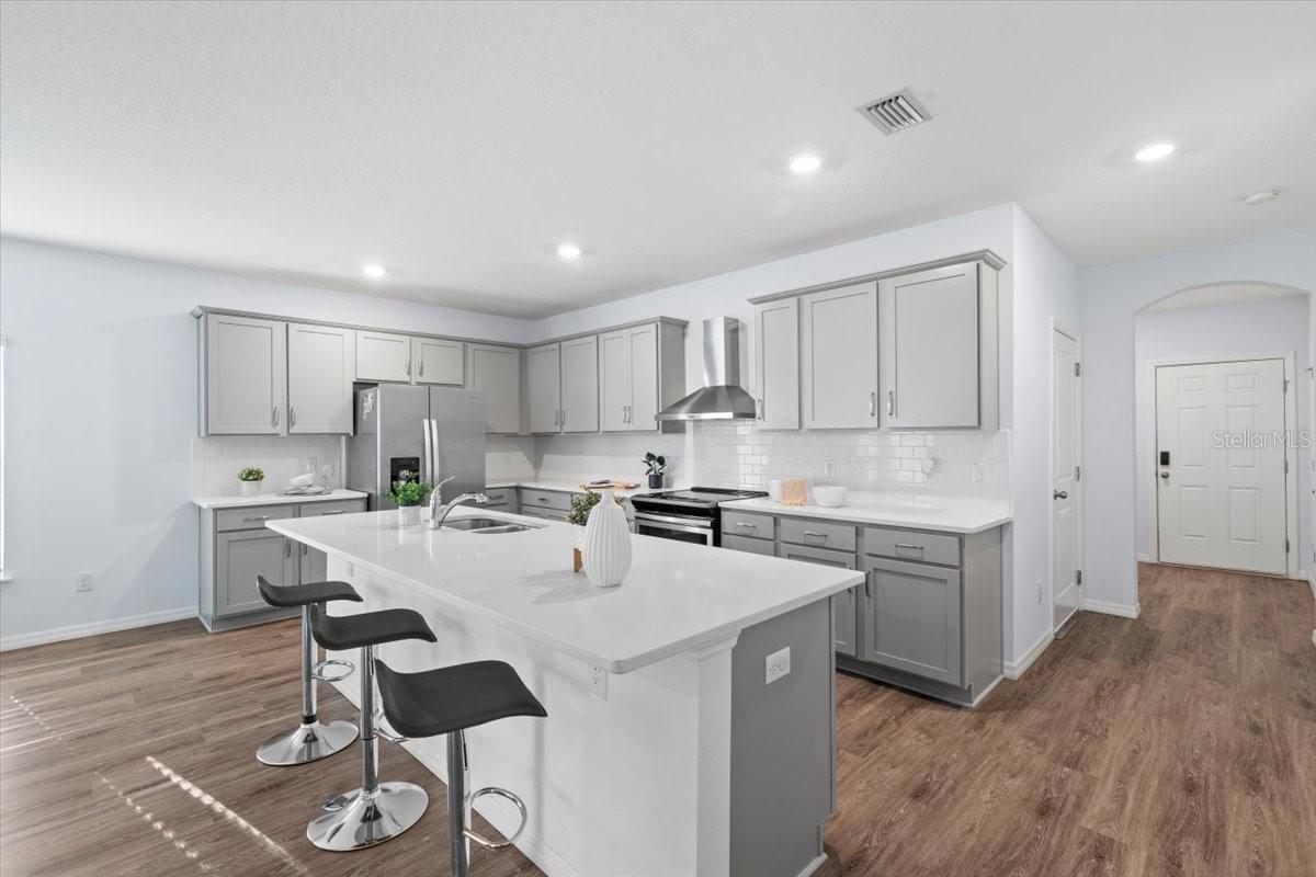 Large kitchen island perfect for gatherings or daily meals.