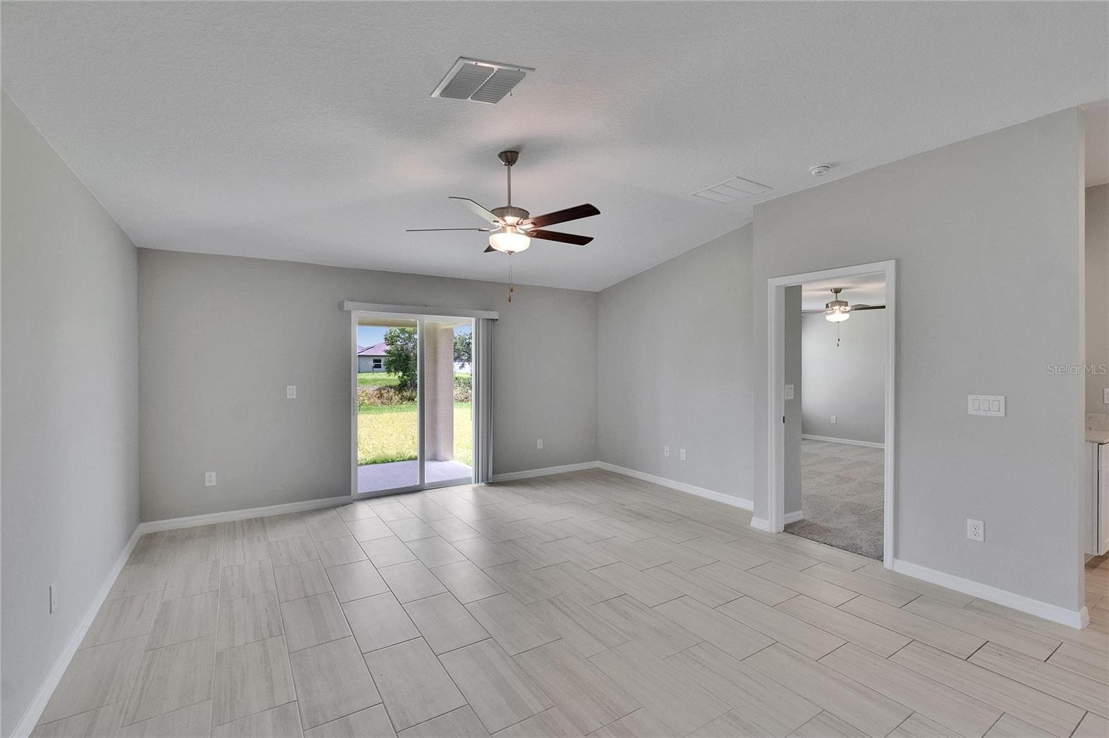 View of Great Room, entrance to Primary Suite to the Right