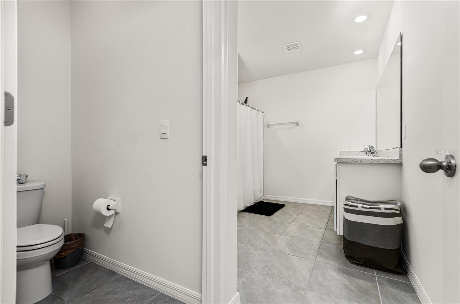 Ensuite Bathroom with linen and water closet