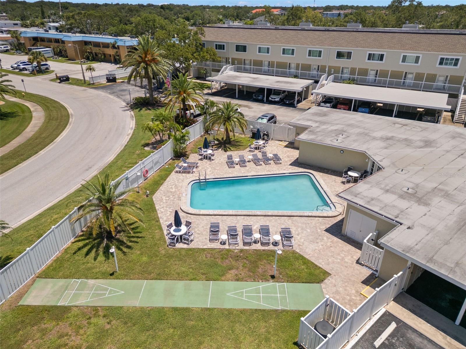Over view of  shuffle board court and gas grill.