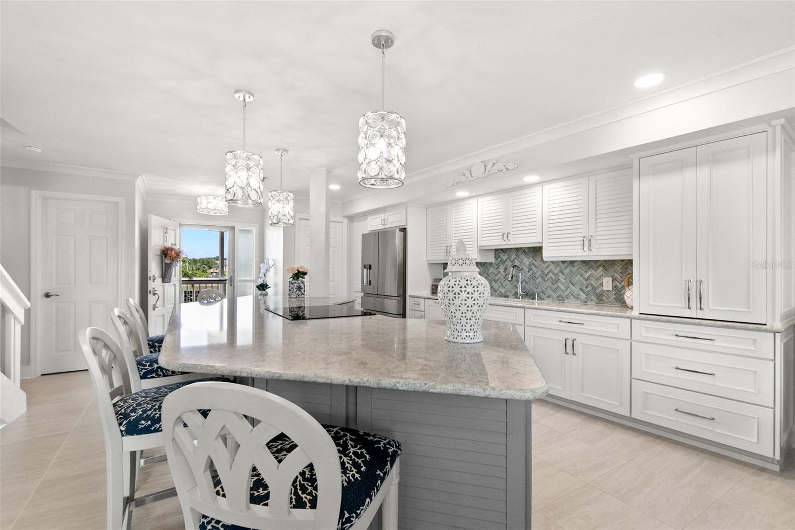 Front entrance of unit with laundry room on right side and powder room on left side