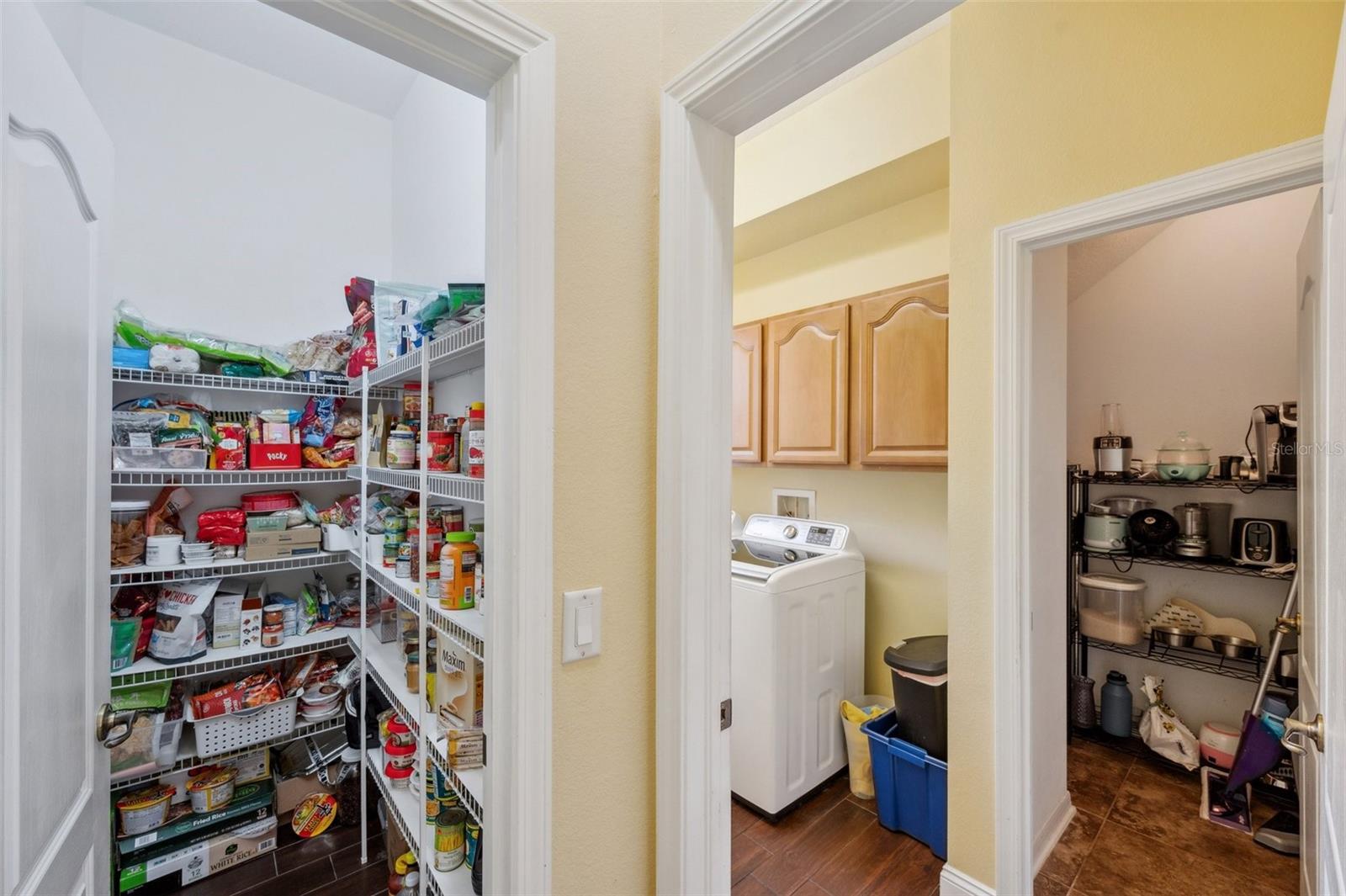 Views of the walk-in pantry, storage room & laundry room