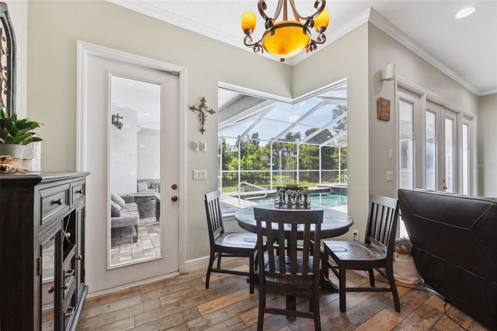 Dining area in kitchen overlooking the pool and spa.