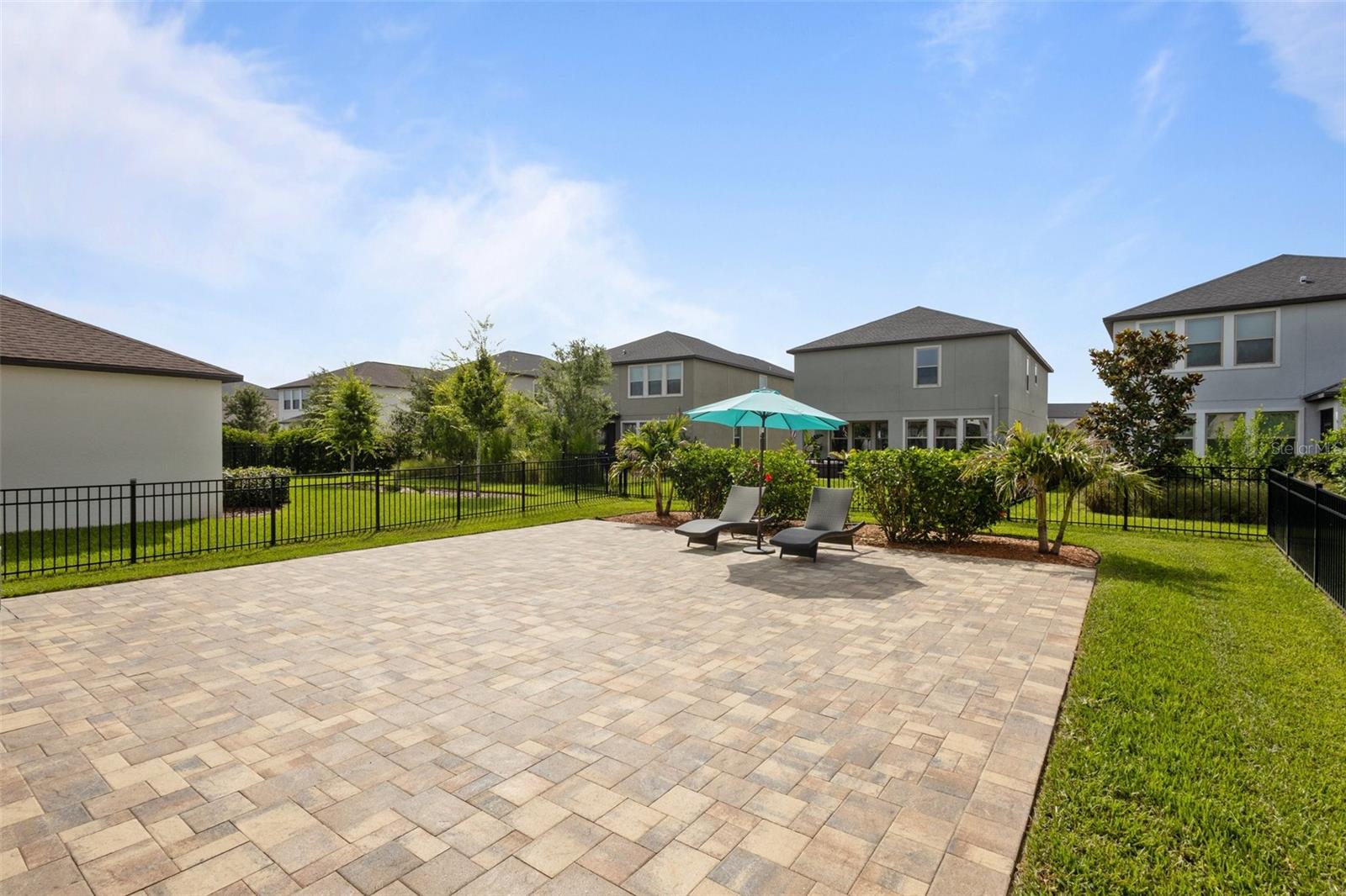 Backyard extrended pavers - fenced in