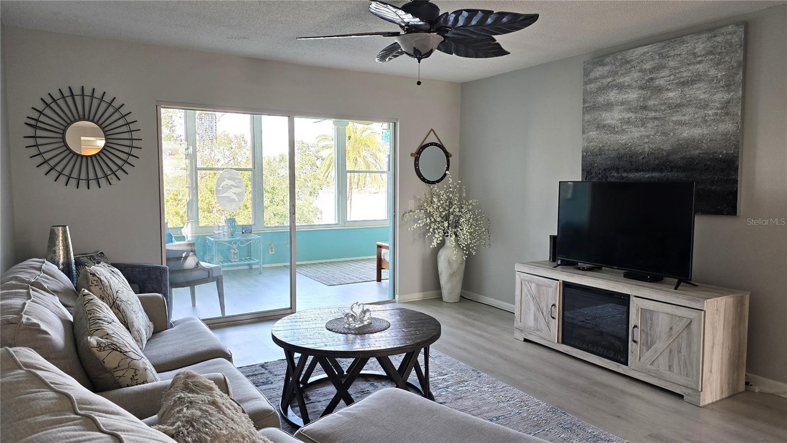 Nice size living room overlooking sunroom