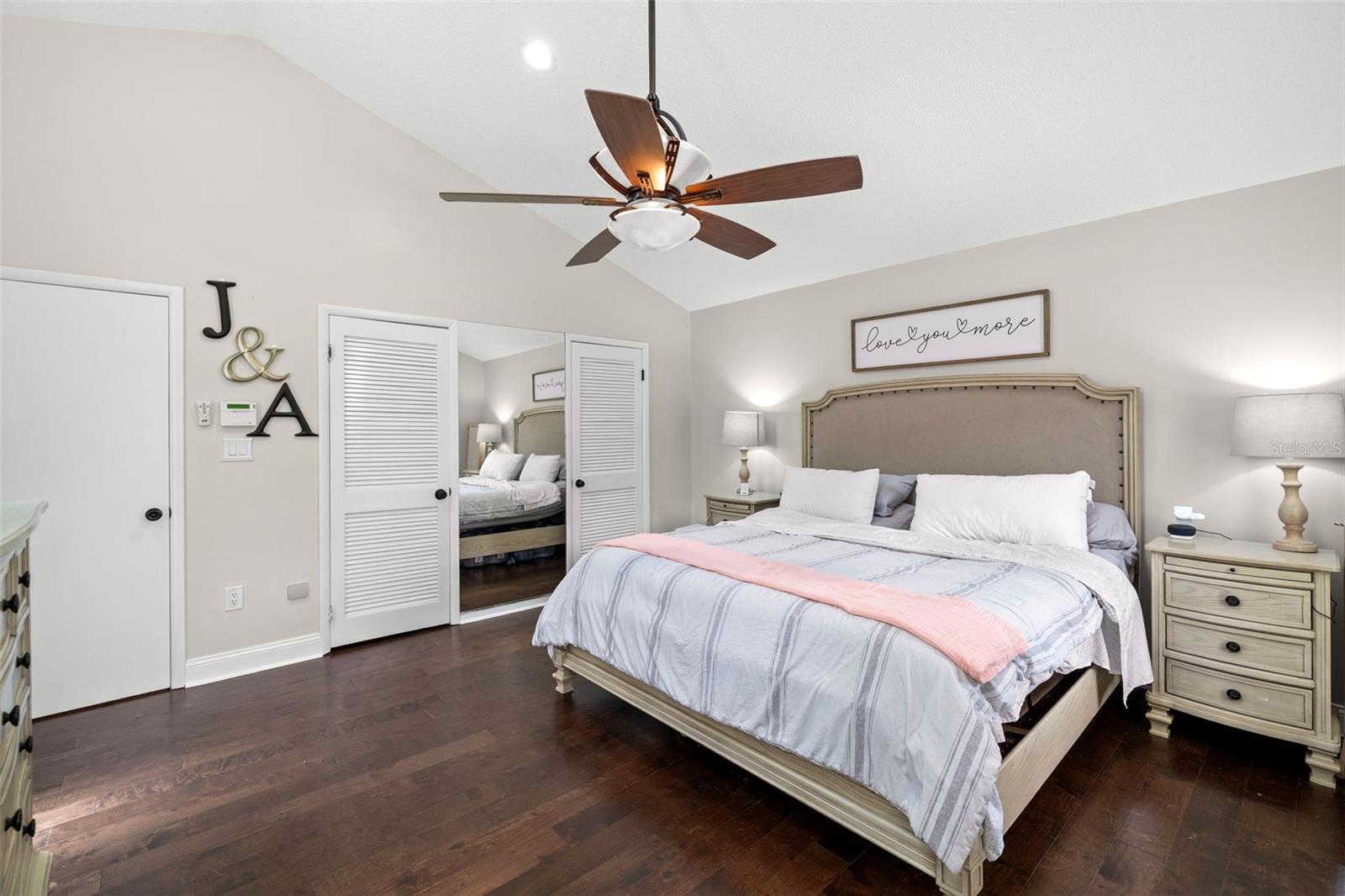 Primary bedroom with walk-in closets and private ensuite