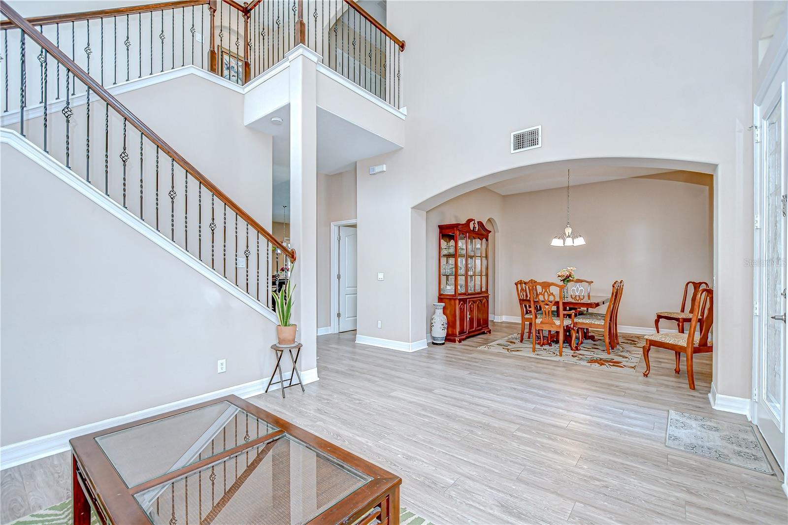 View from formal living room toward dining room, foyer and stairs.