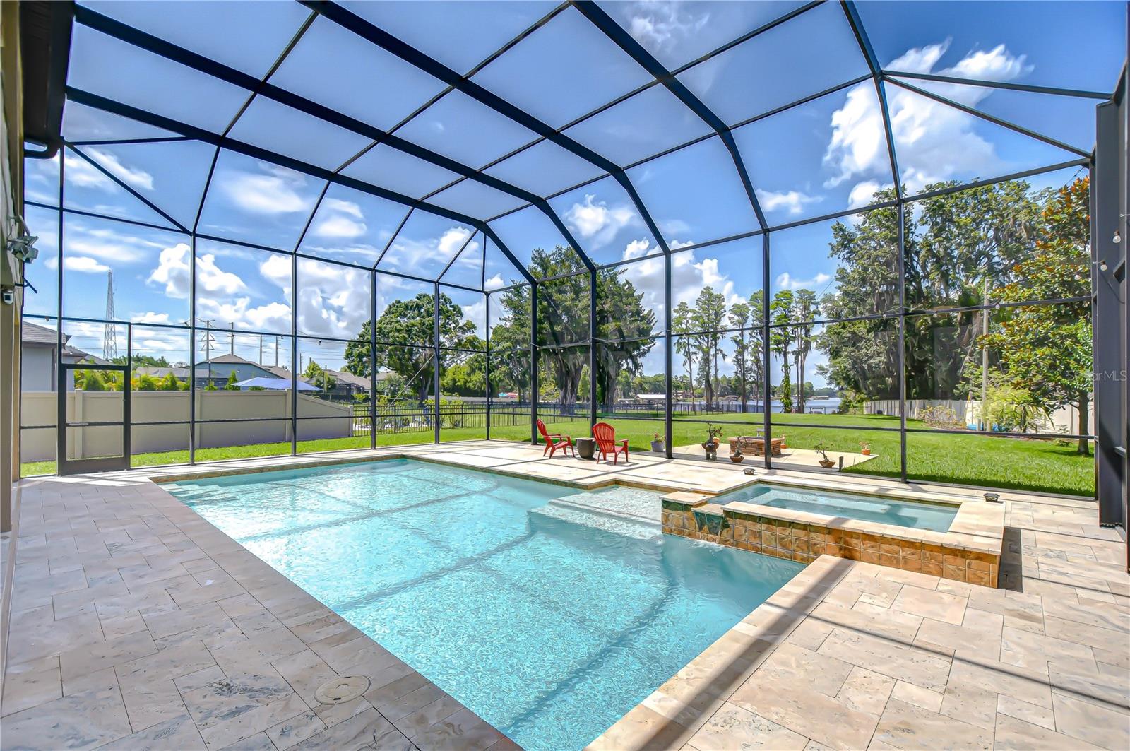 Pool with 2 story screened enclosure