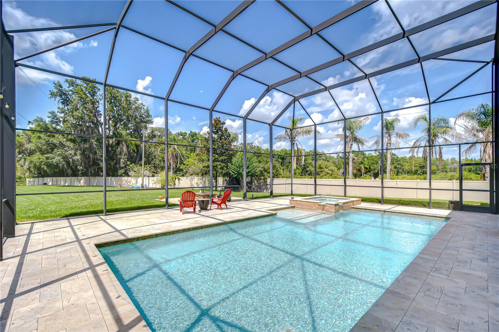 View of pool and backyard