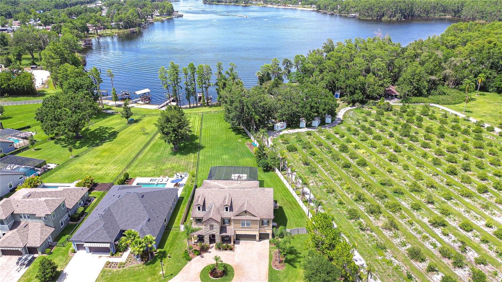 Aerial view of house and lake