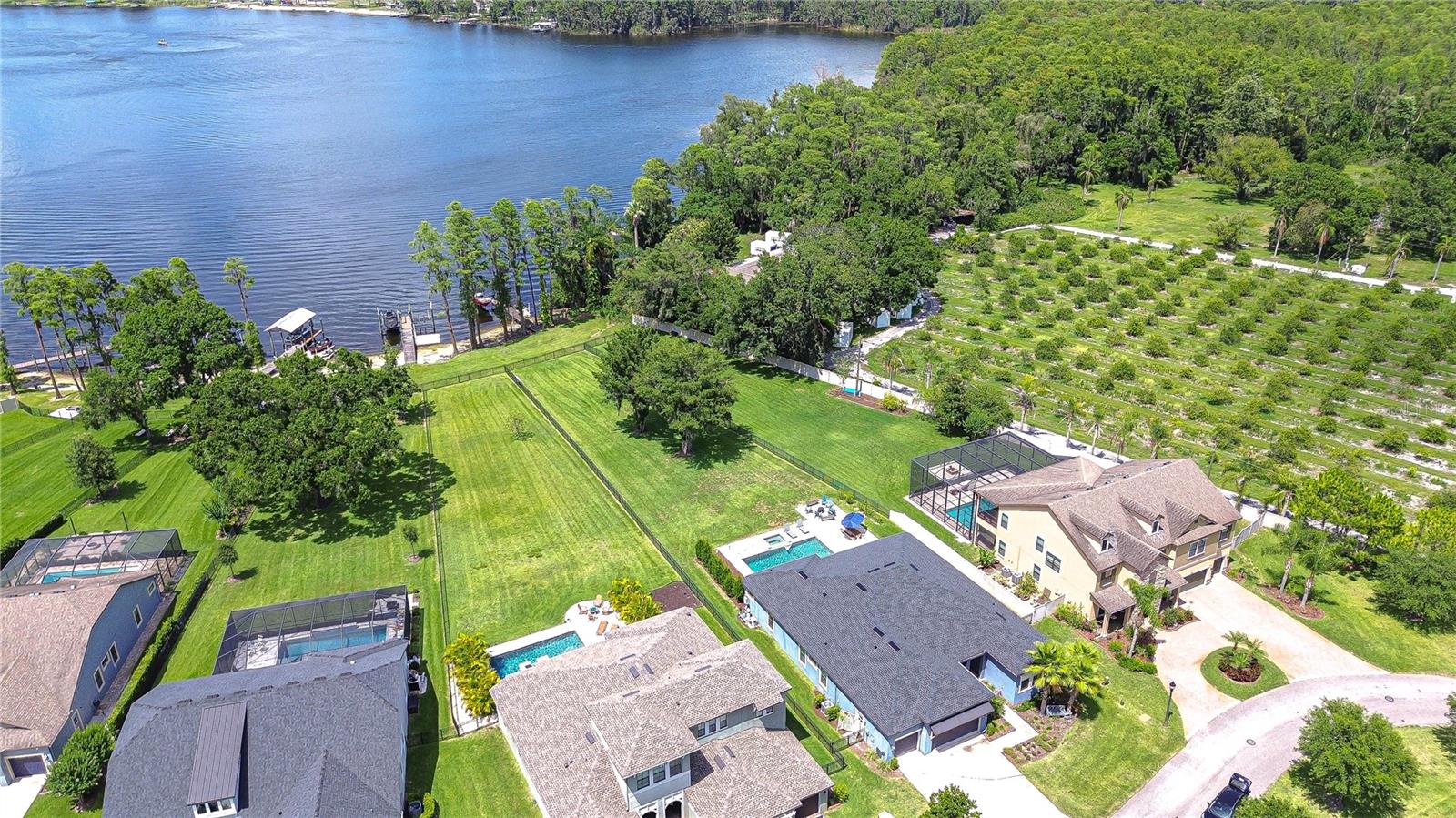 Aerial view of small private community of Manors at Lake Padgett