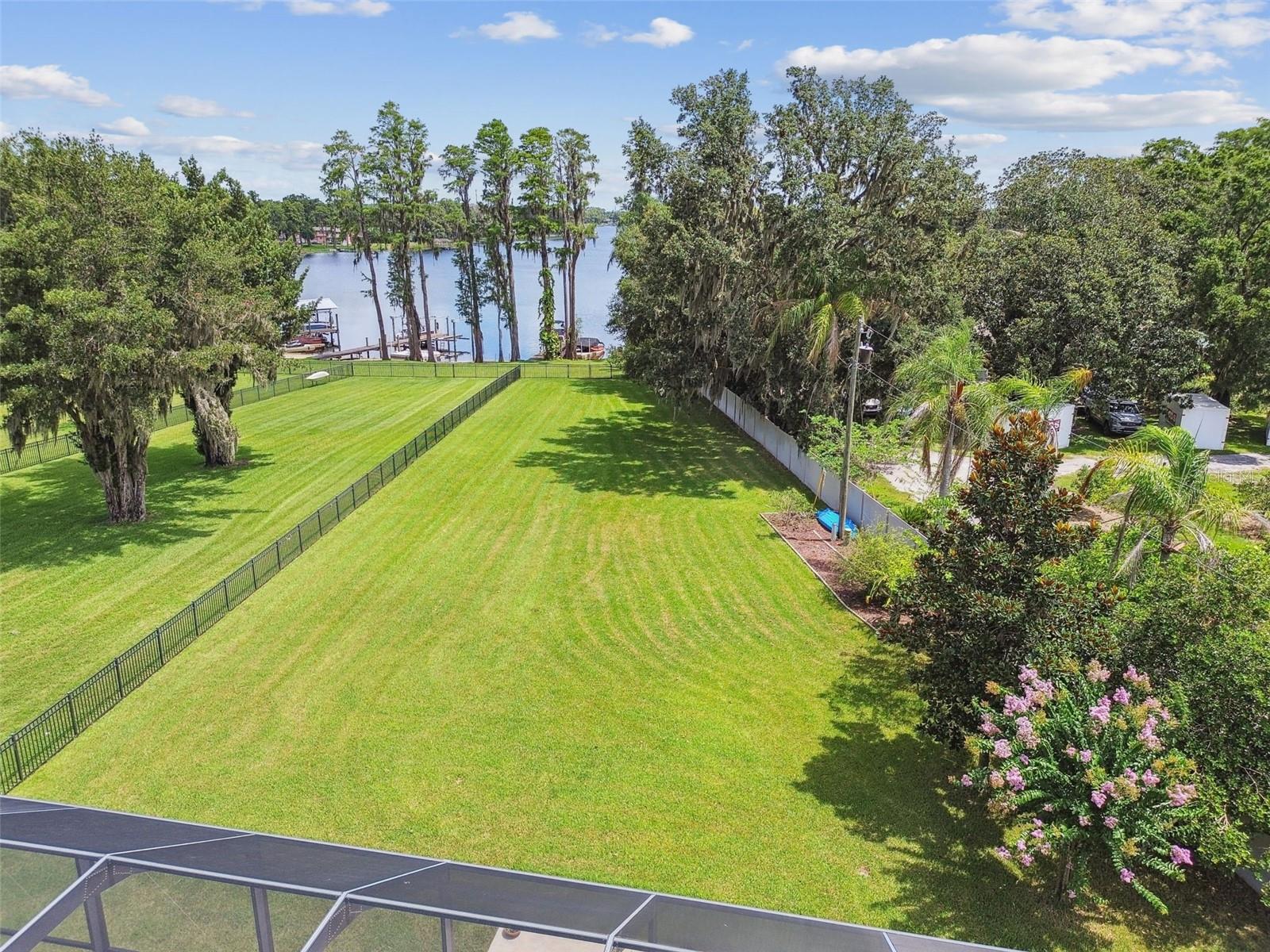 Aerial view of long back yard to 200 acre lake