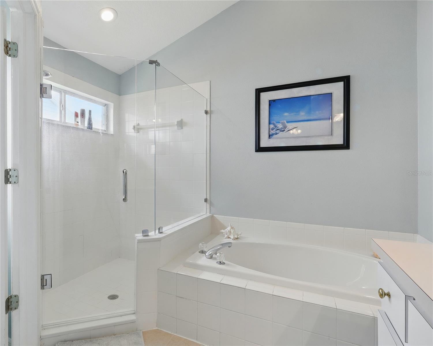 This bathroom has a linen closet and 2 walk in closets!