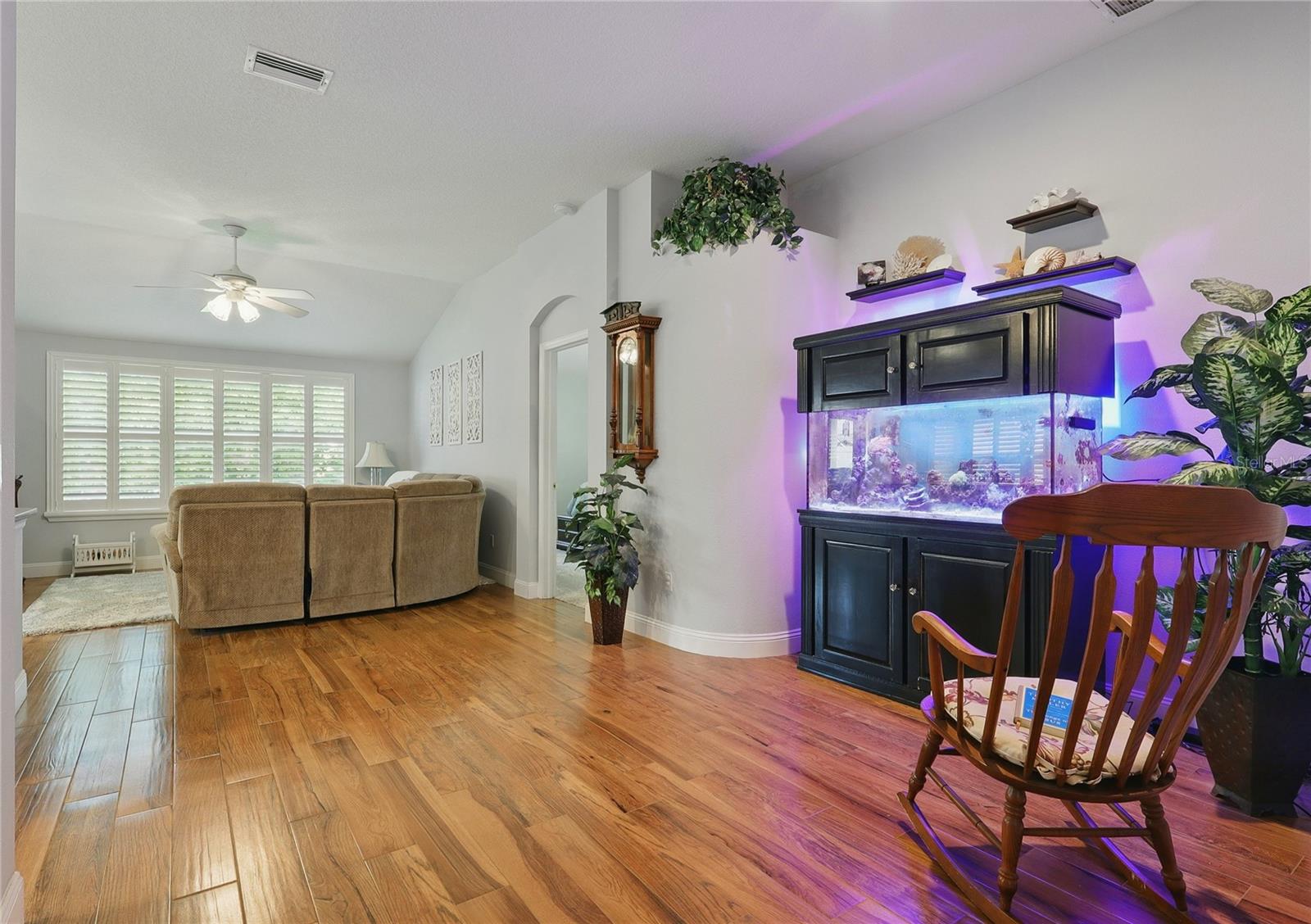 Glancing toward the living room.