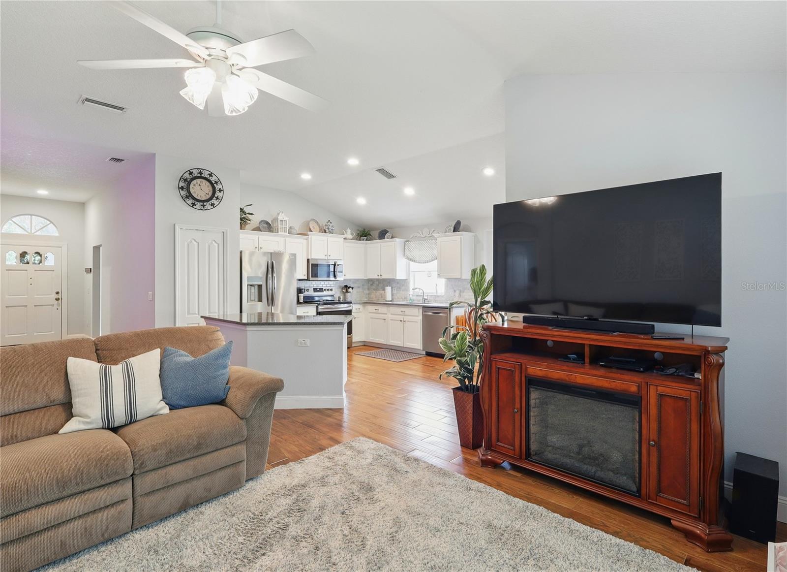 glancing toward the kitchen.