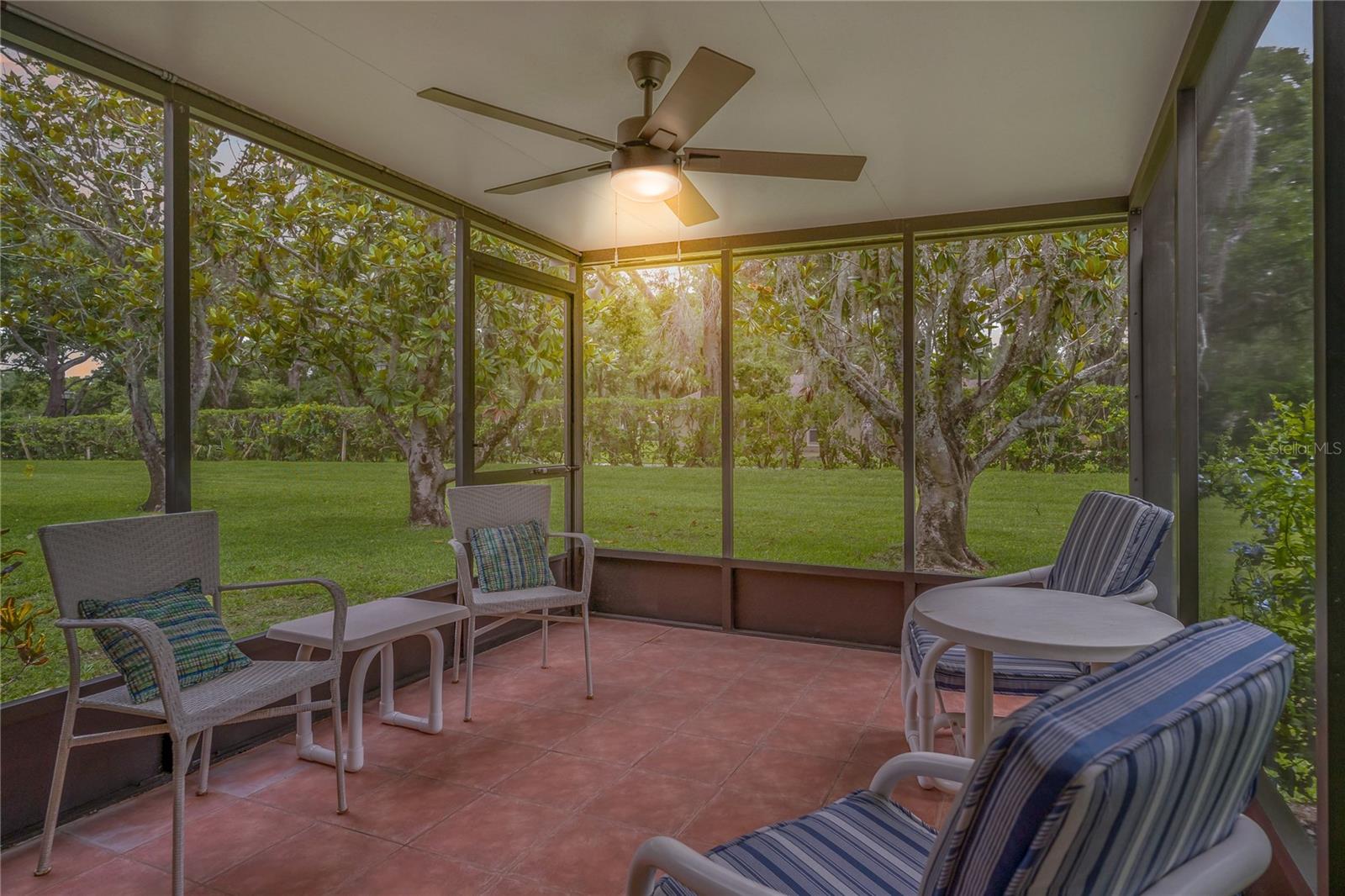 RELAX IN YOUR COVERED AND SCREENED IN BACK PATIO