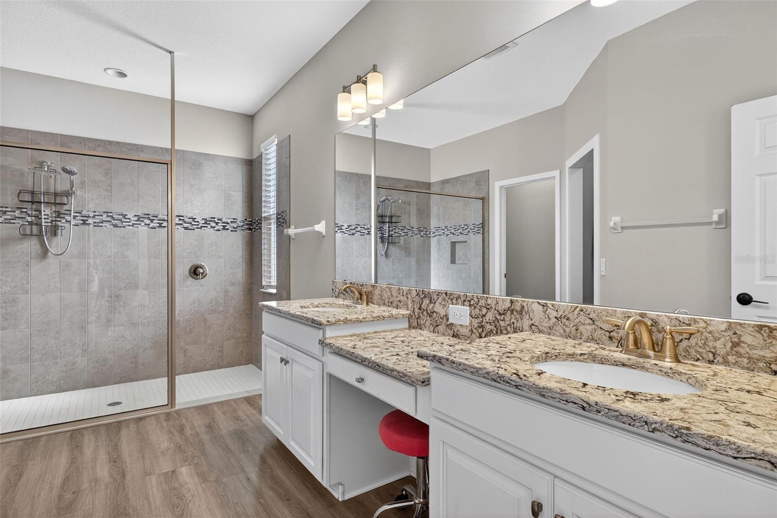 Vanity, double sink, walk-in shower.