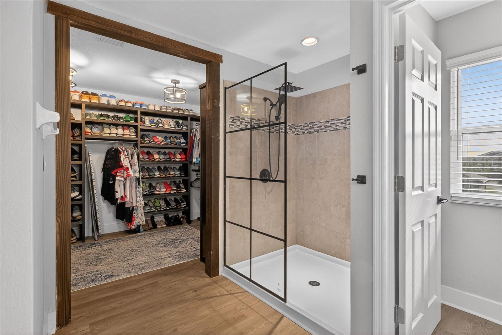 New glass wall shower added & the closet is show-stopping (see the 4th photo for this closet)