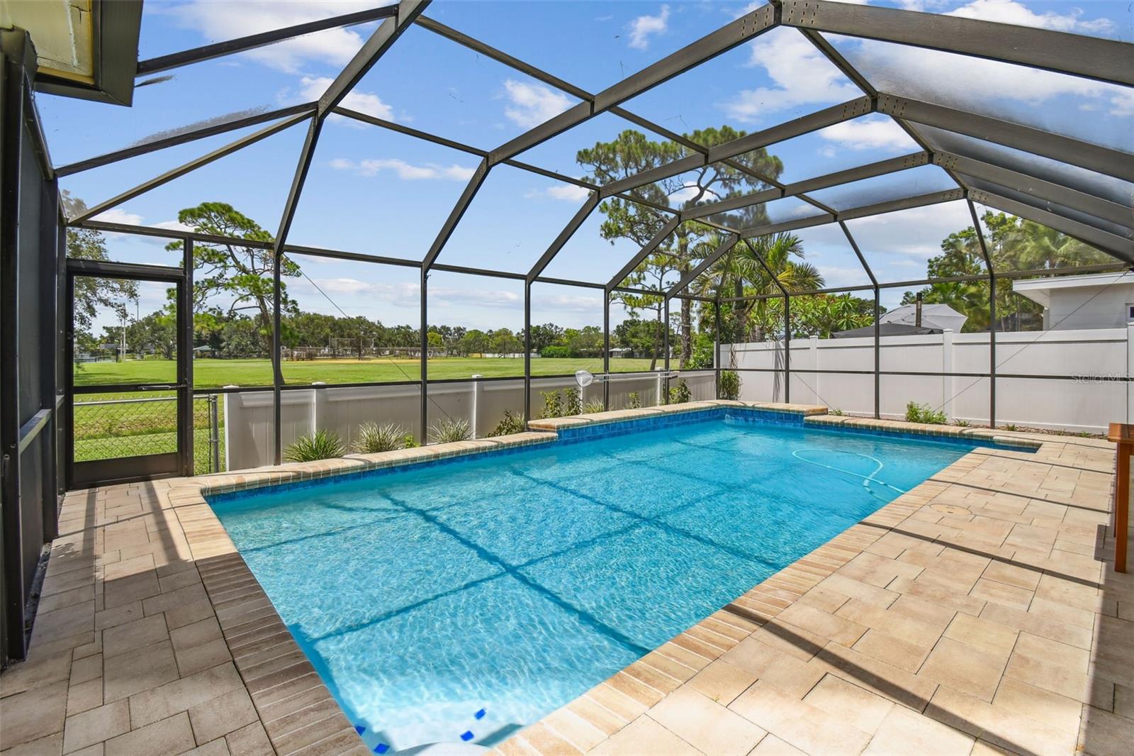 Screened saltwater pool with view of Denver Park