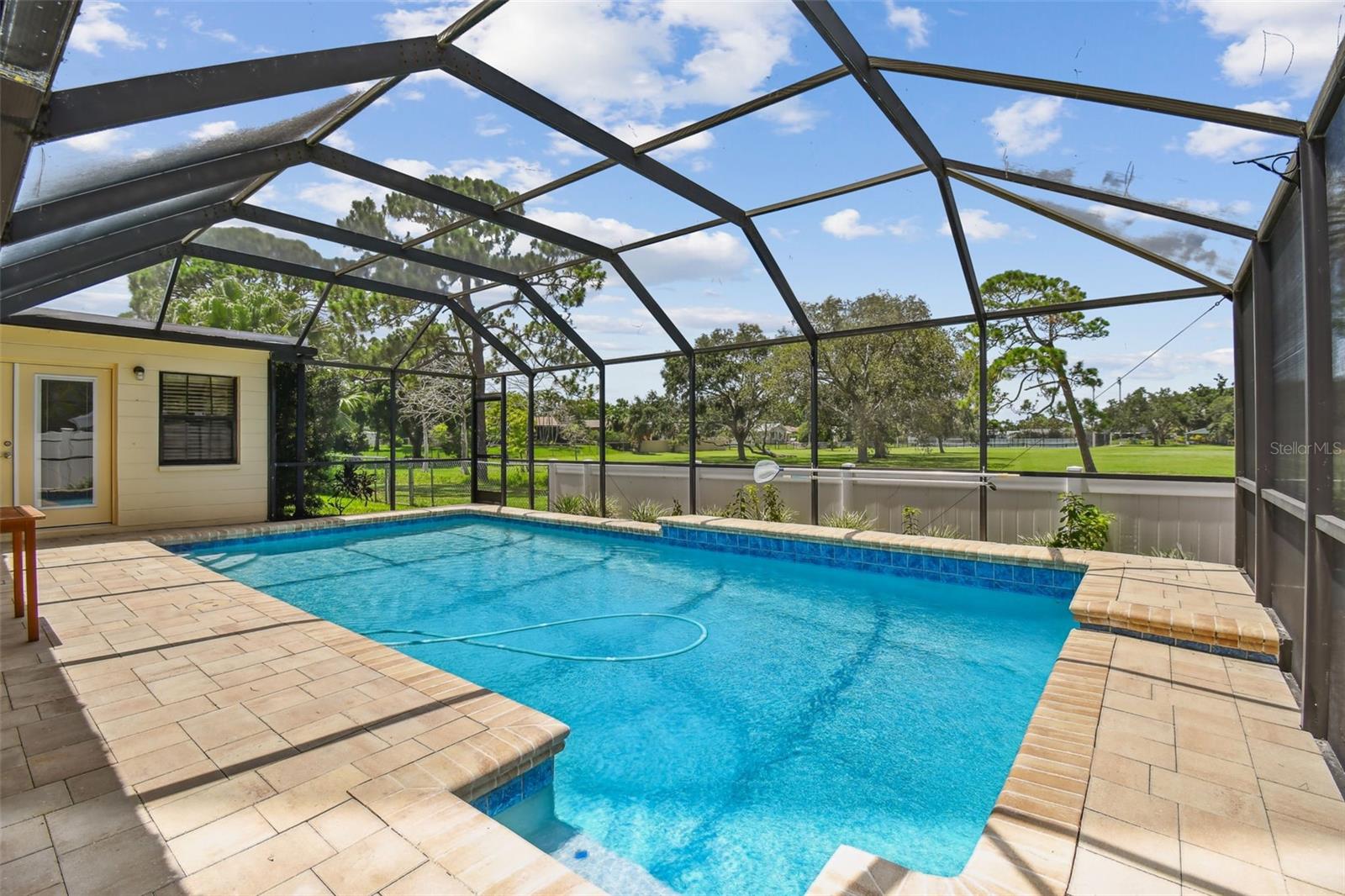 Screened saltwater pool with view of Denver Park