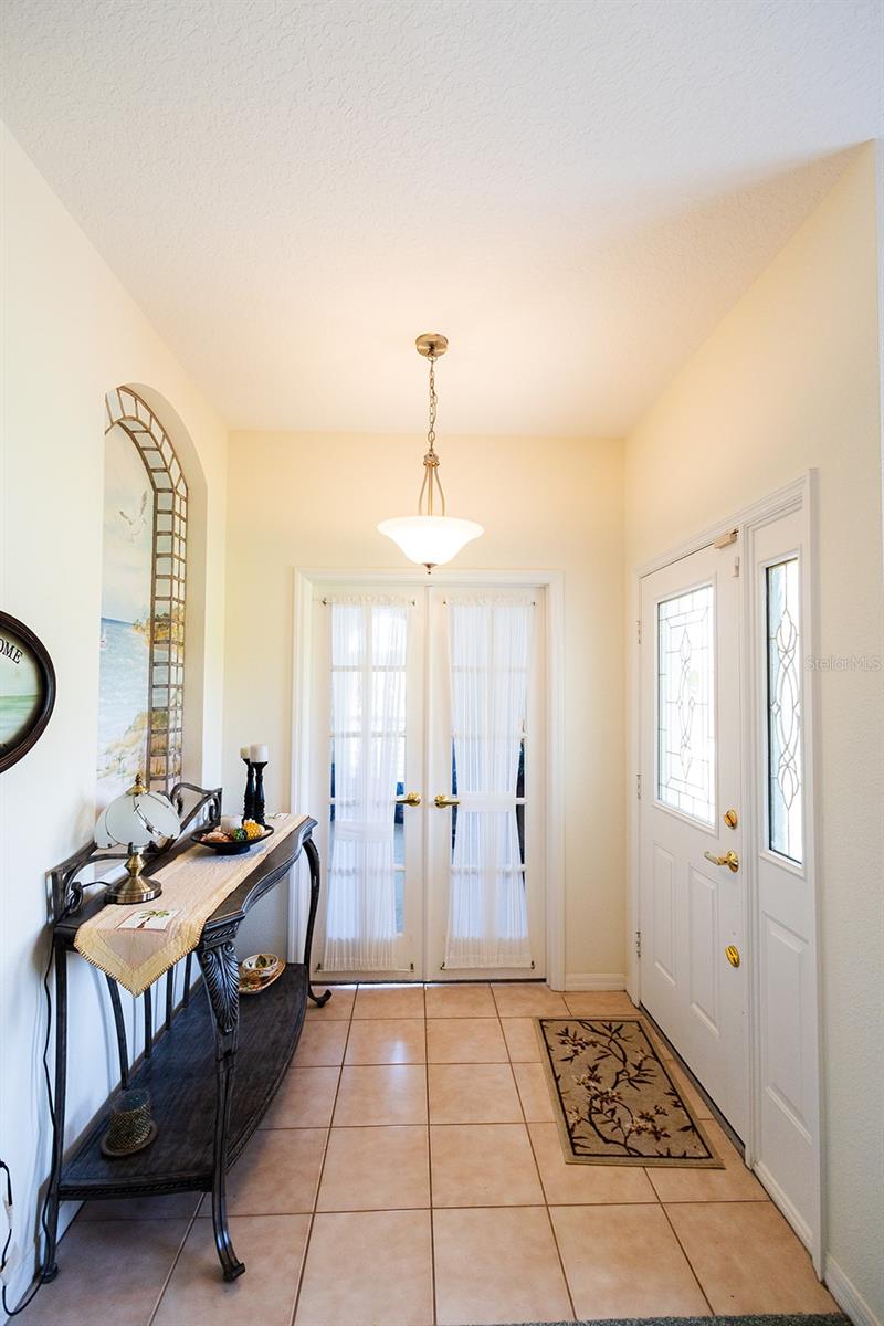 Entry area with doors closed providing privacy in the large office.