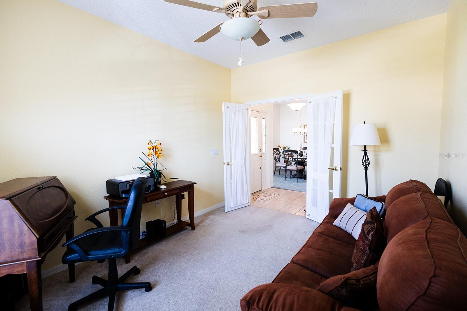 Office area with westerly facing windows that allow lots of natural light.