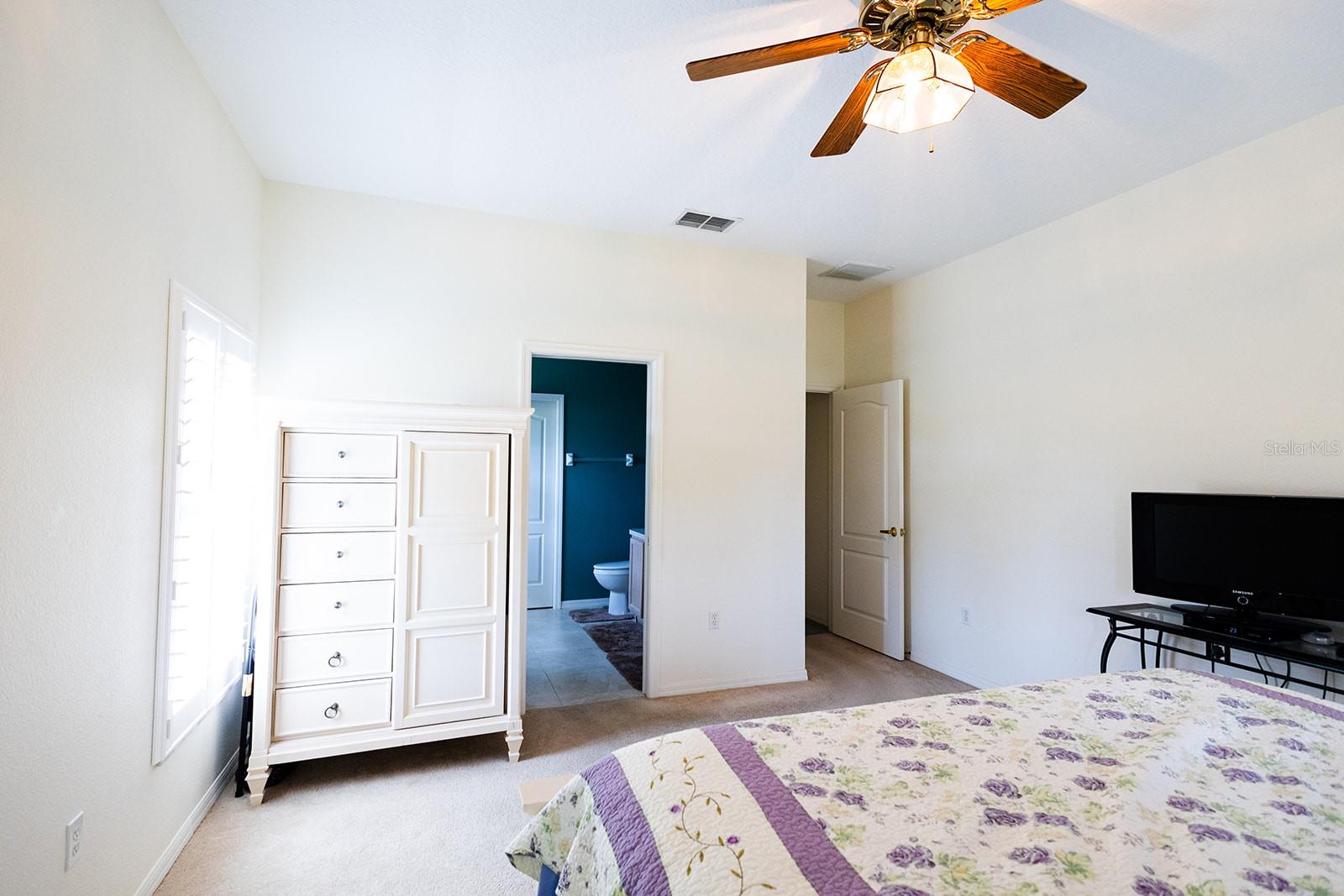Master bedroom with en-suite and beyond the bath is a spacious walk-in closet with lots of storage space.
