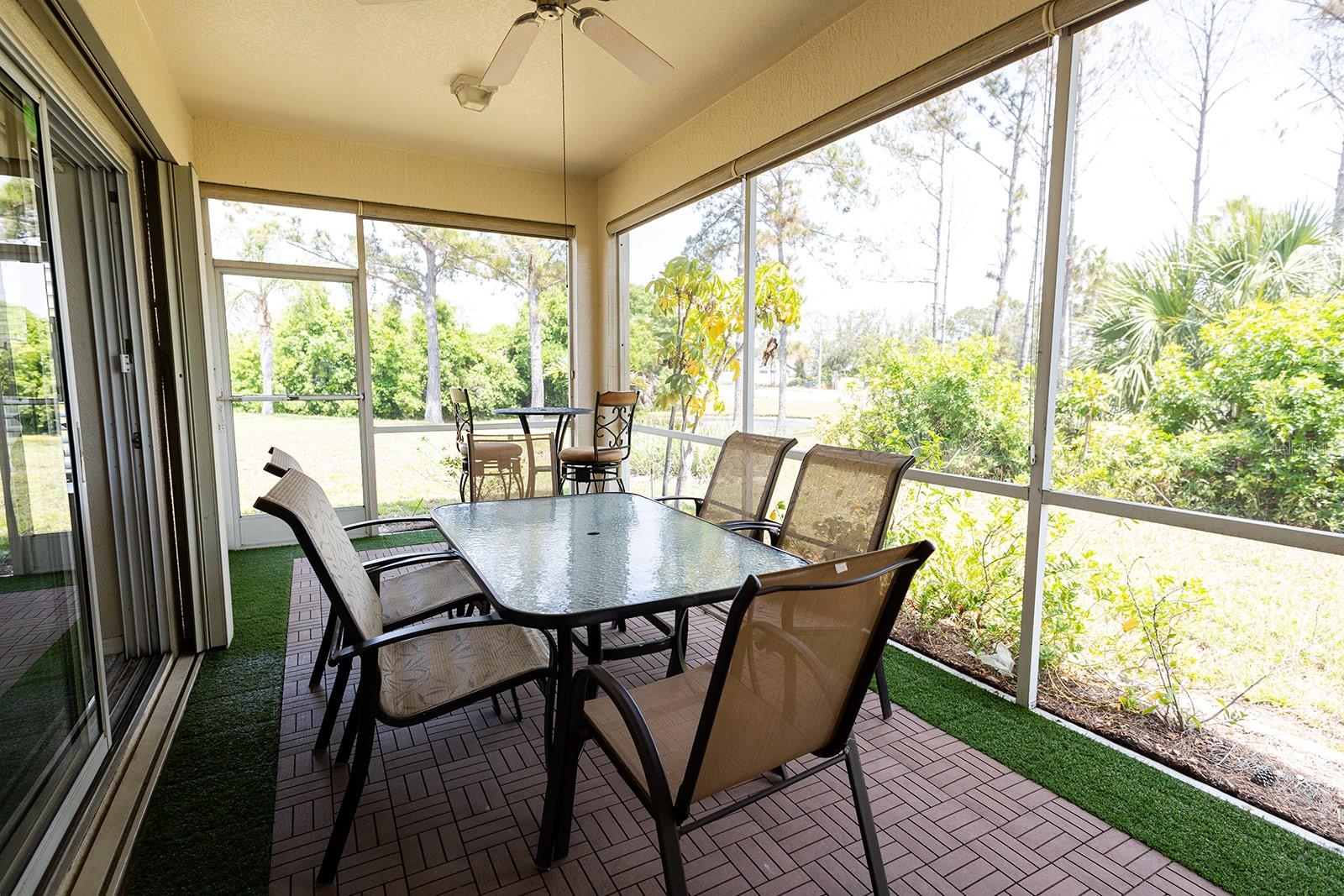 Beautiful private lanai area on the rear of the home with a pond view and mature landscaping!