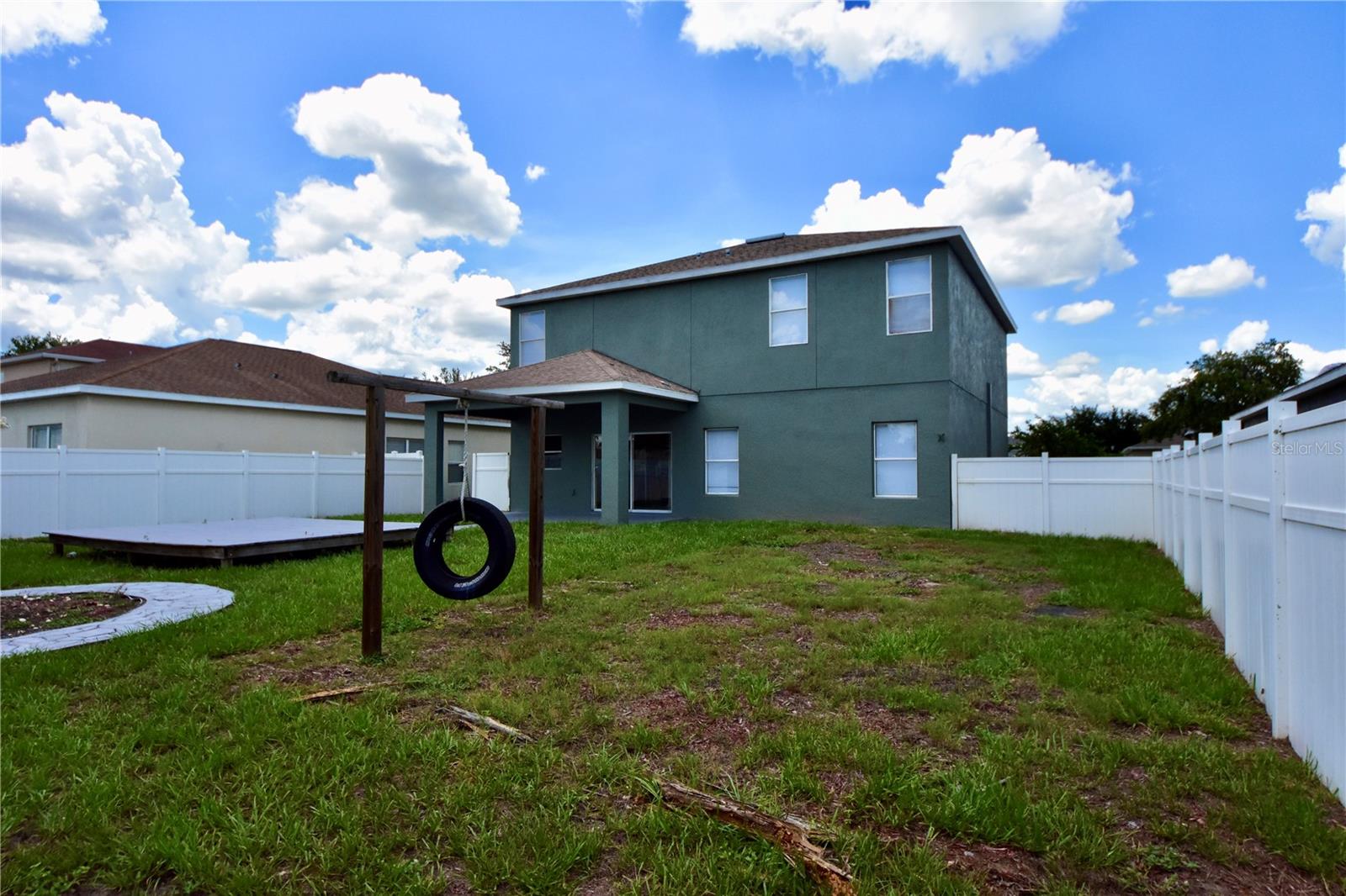 back of house with yard