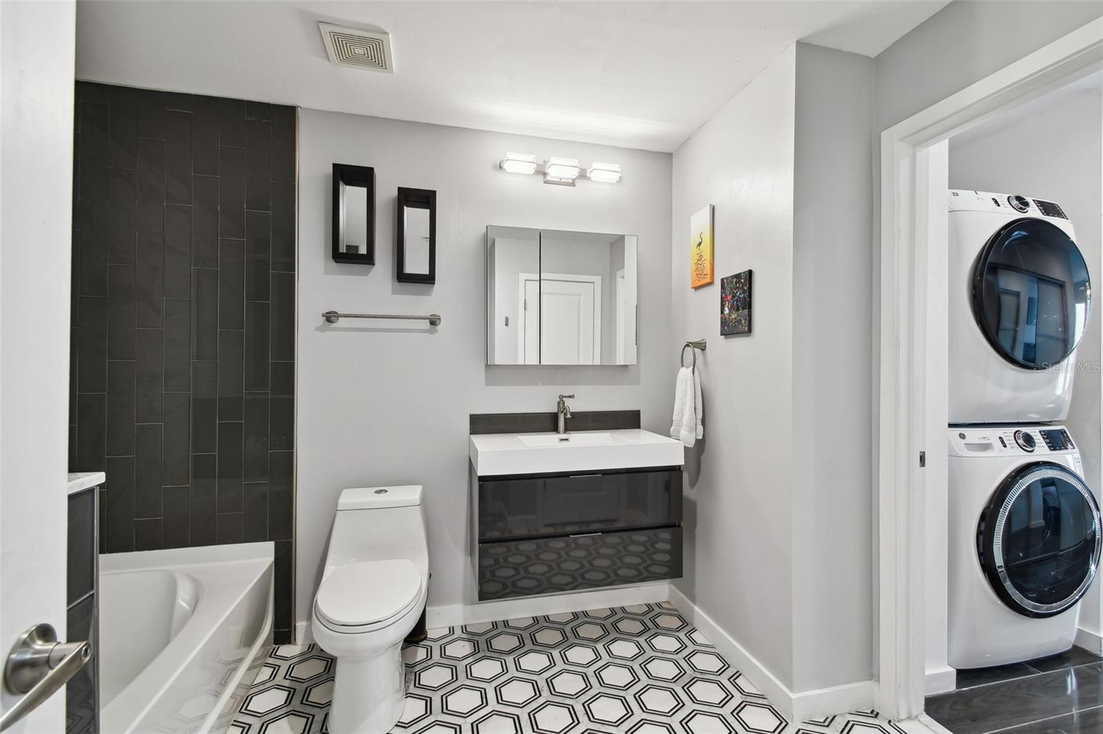 Convenient in-unit laundry with a full-size washer and dryer adds to the appeal.