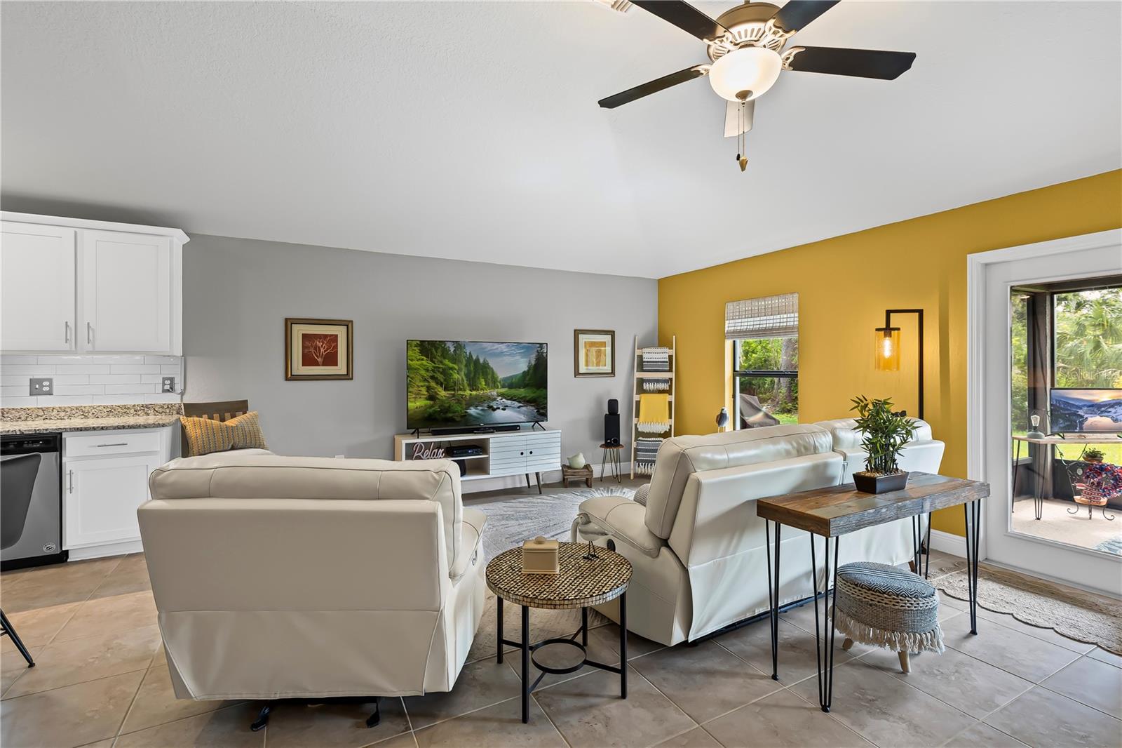 Living Room overlooks the lanai and backyard