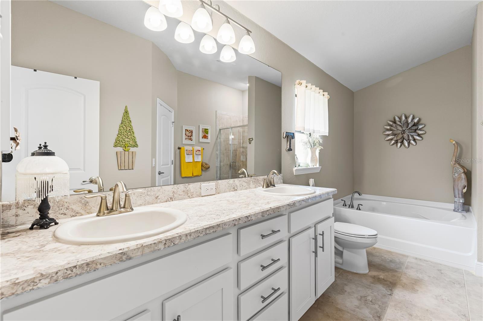 EN SUITE BATH with white cabinets
