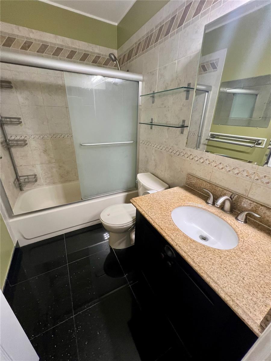 Updated bath has beautiful tile work