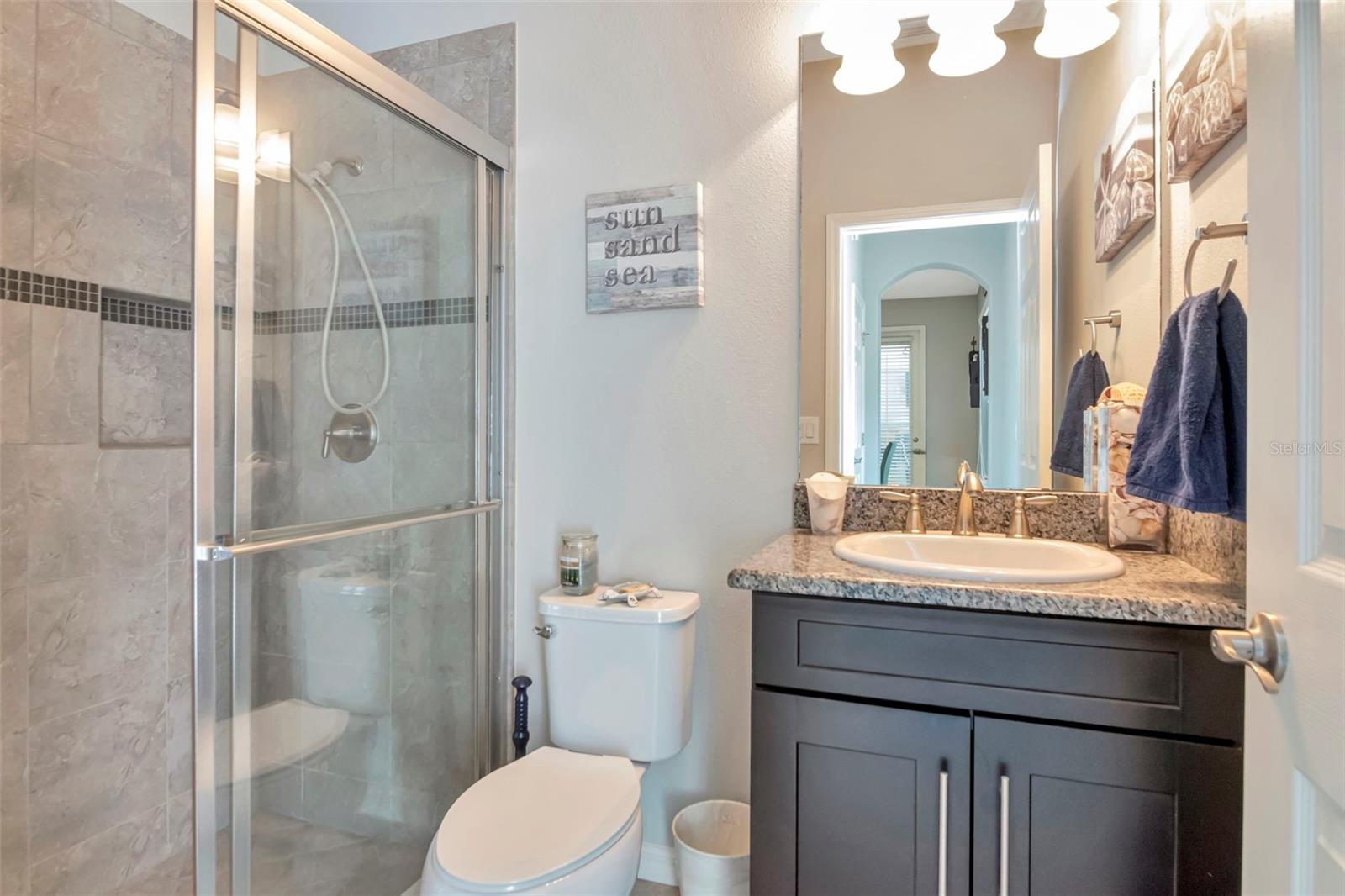 POOL BATHROOM with outdoor access.
