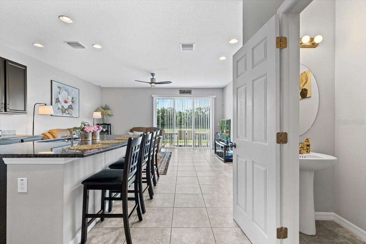 Convenient downstairs half bath + open sightlines to kitchen and living areas.