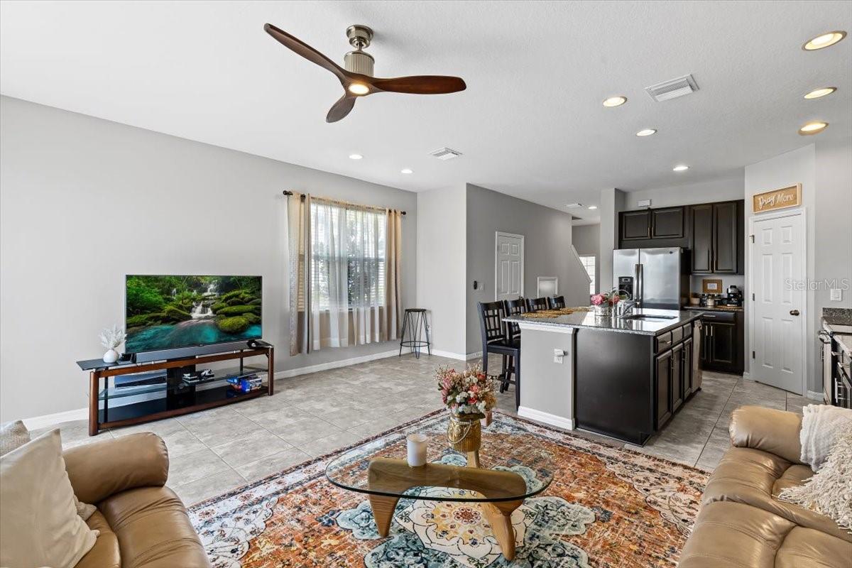 Spacious living area with upgraded lighting and easy-care flooring throughout.