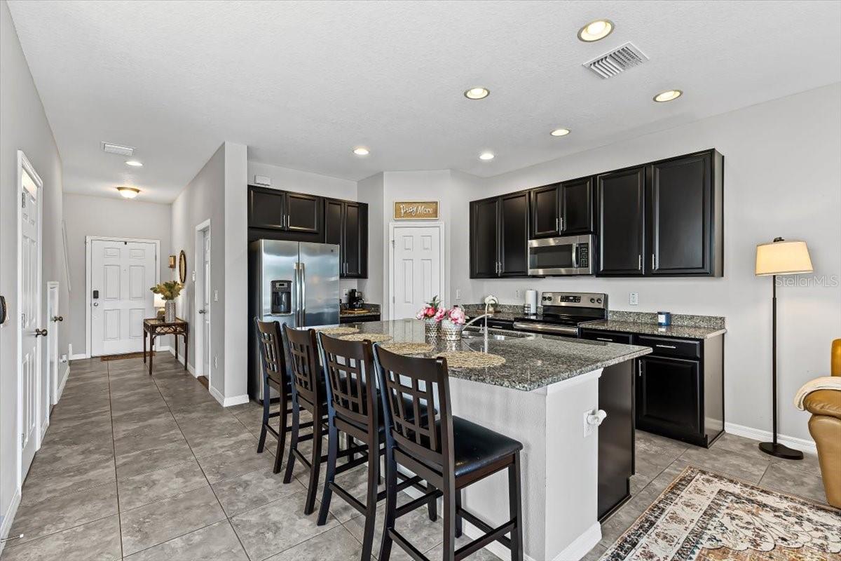 Stunning oversized kitchen island with modern finishes. Ideal for entertaining or meal prep in your new Florida home.
