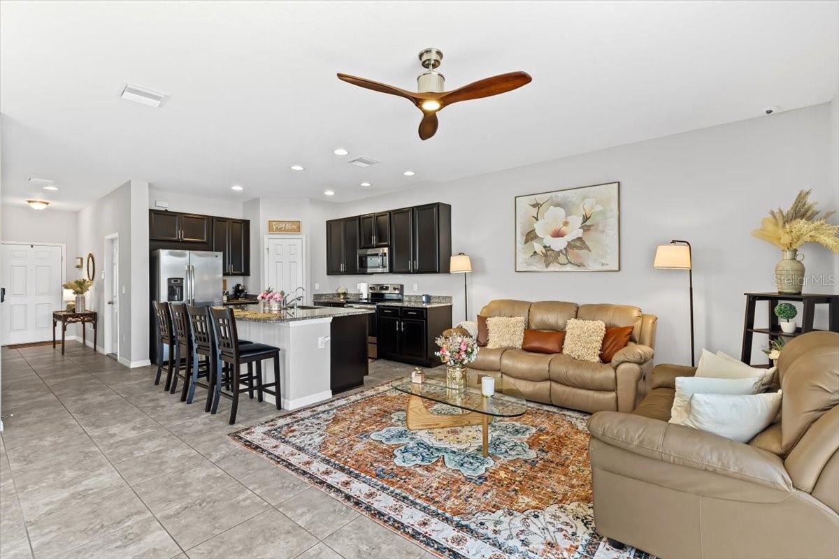 Open-concept layout with seamless kitchen & living room flow, perfect for gatherings or cozy nights in.