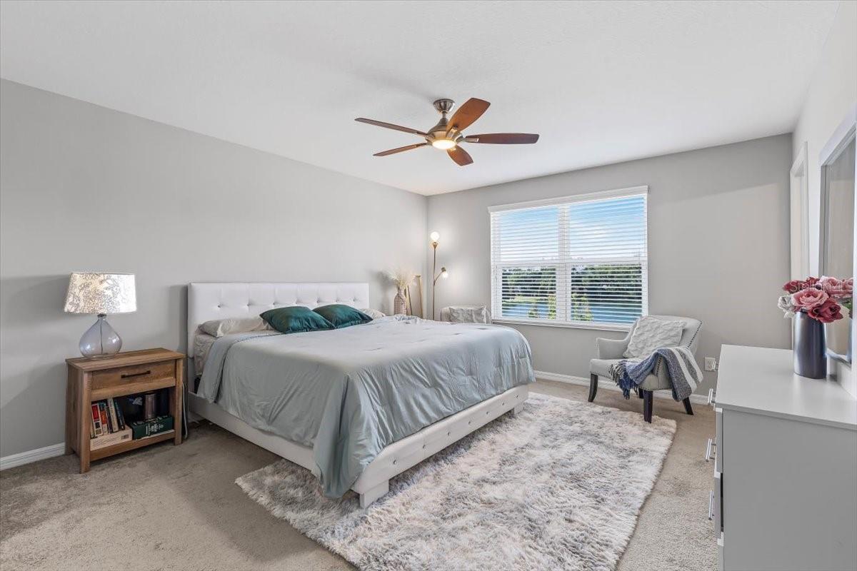 Wake up to peaceful pond views from your spacious primary suite retreat.