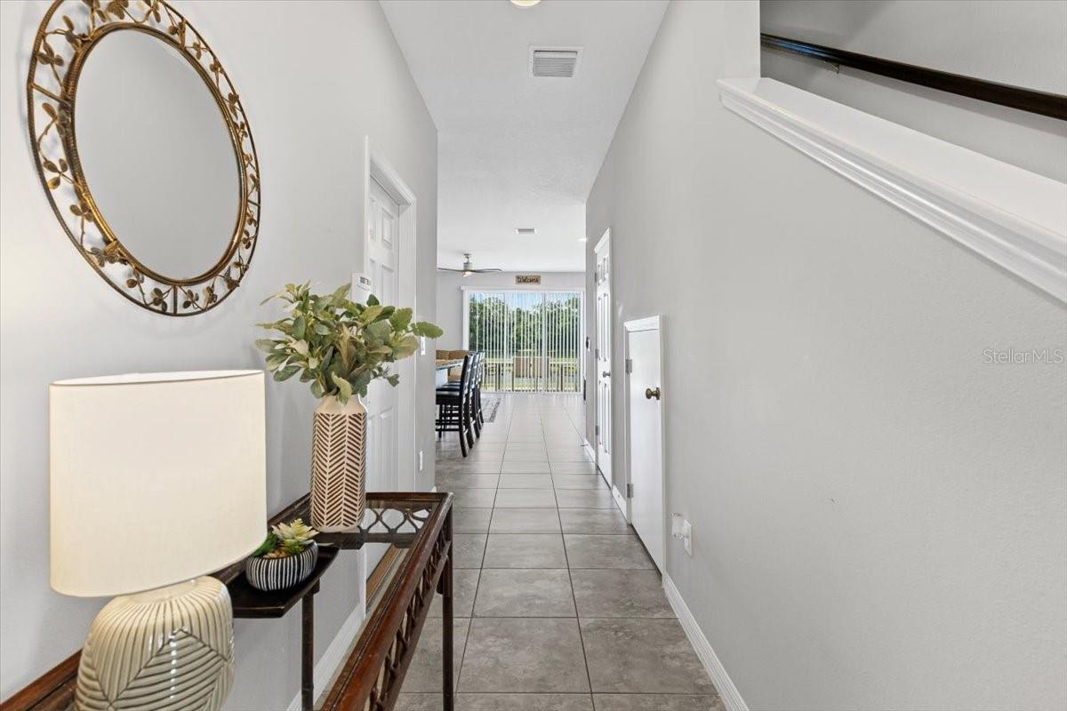 Welcoming foyer with natural light and neutral tones sets the tone for this move-in ready home.
