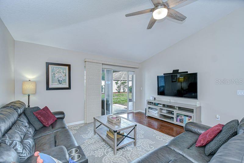 Family Room opens to Covered Lanai and Backyard.