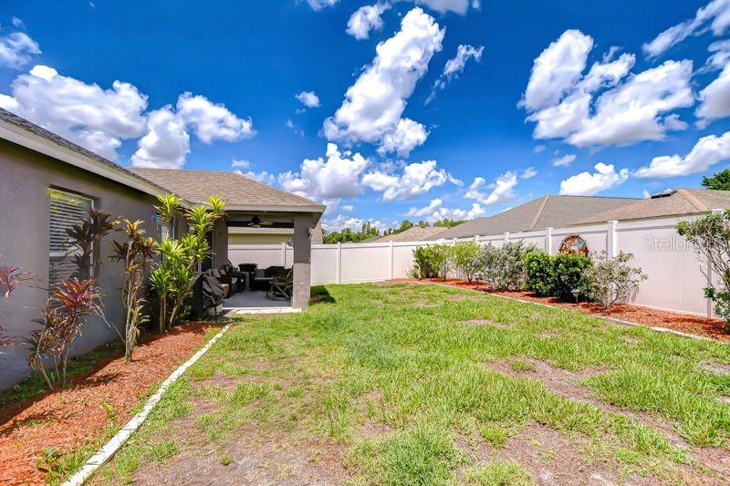 Spacious Backyard with plenty of room to create your own space.