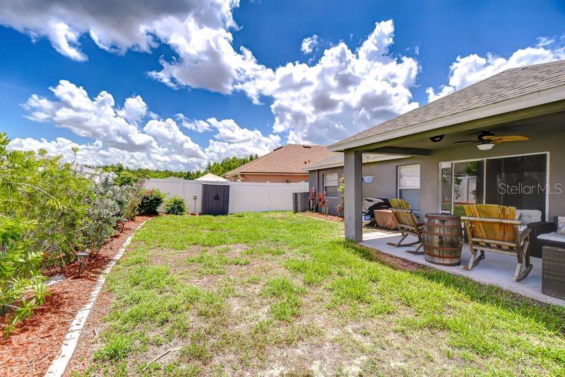 Fully fenced with storage shed.