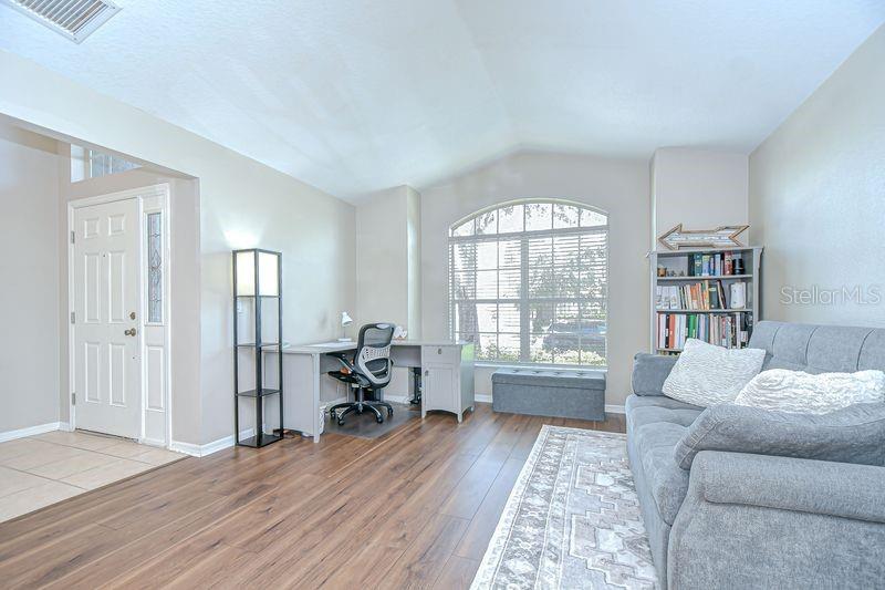 Formal Living Room or Office Space with new laminate wood flooring.
