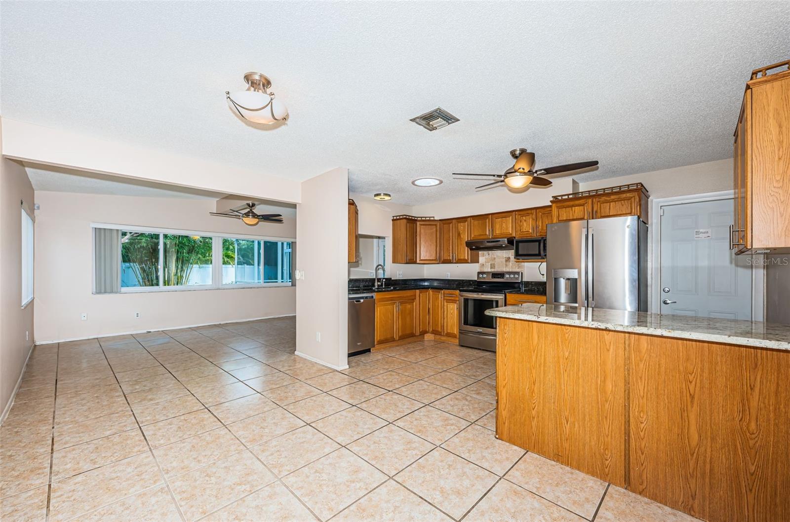 Kitchen with breakfast bar and access to garage