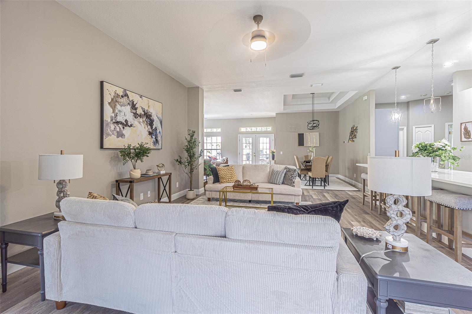 High Ceilings and beautiful neutral interior paint compliment the luxury vinyl flooring through the home