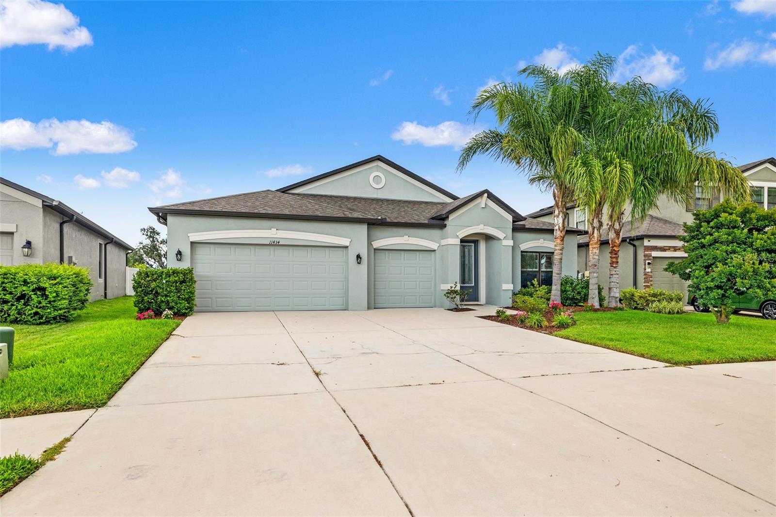 Large 3 car garage with additional guest parking