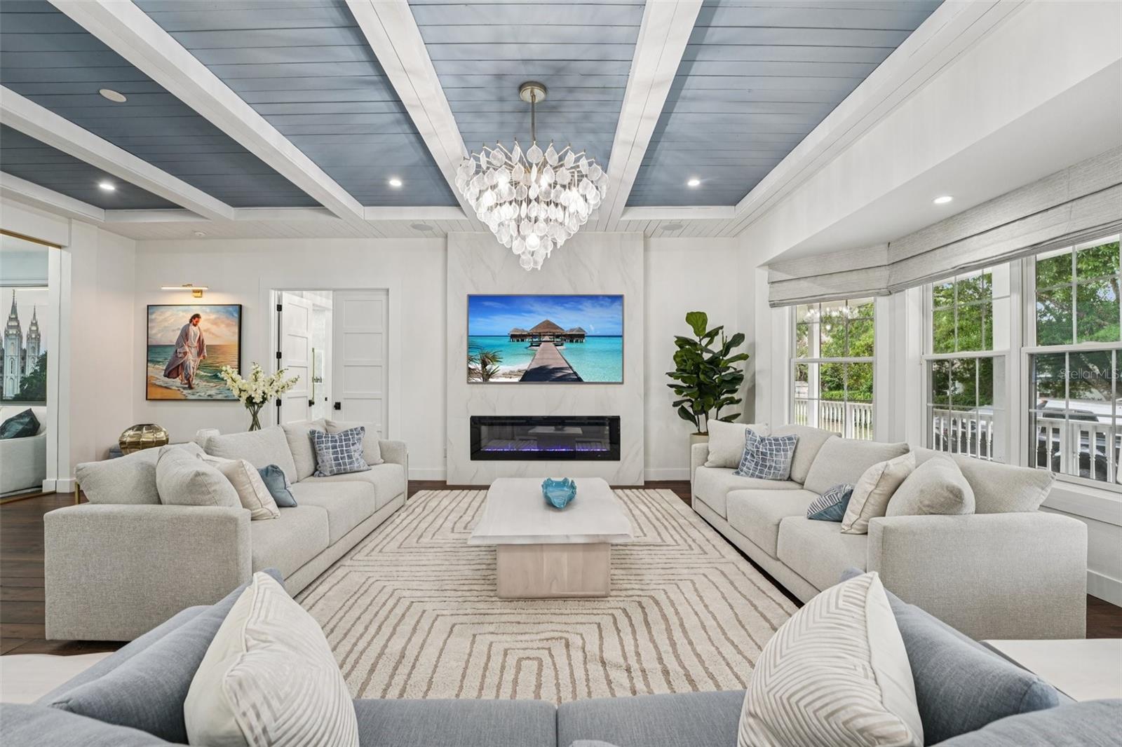 Family room with ship lap and beam ceiling