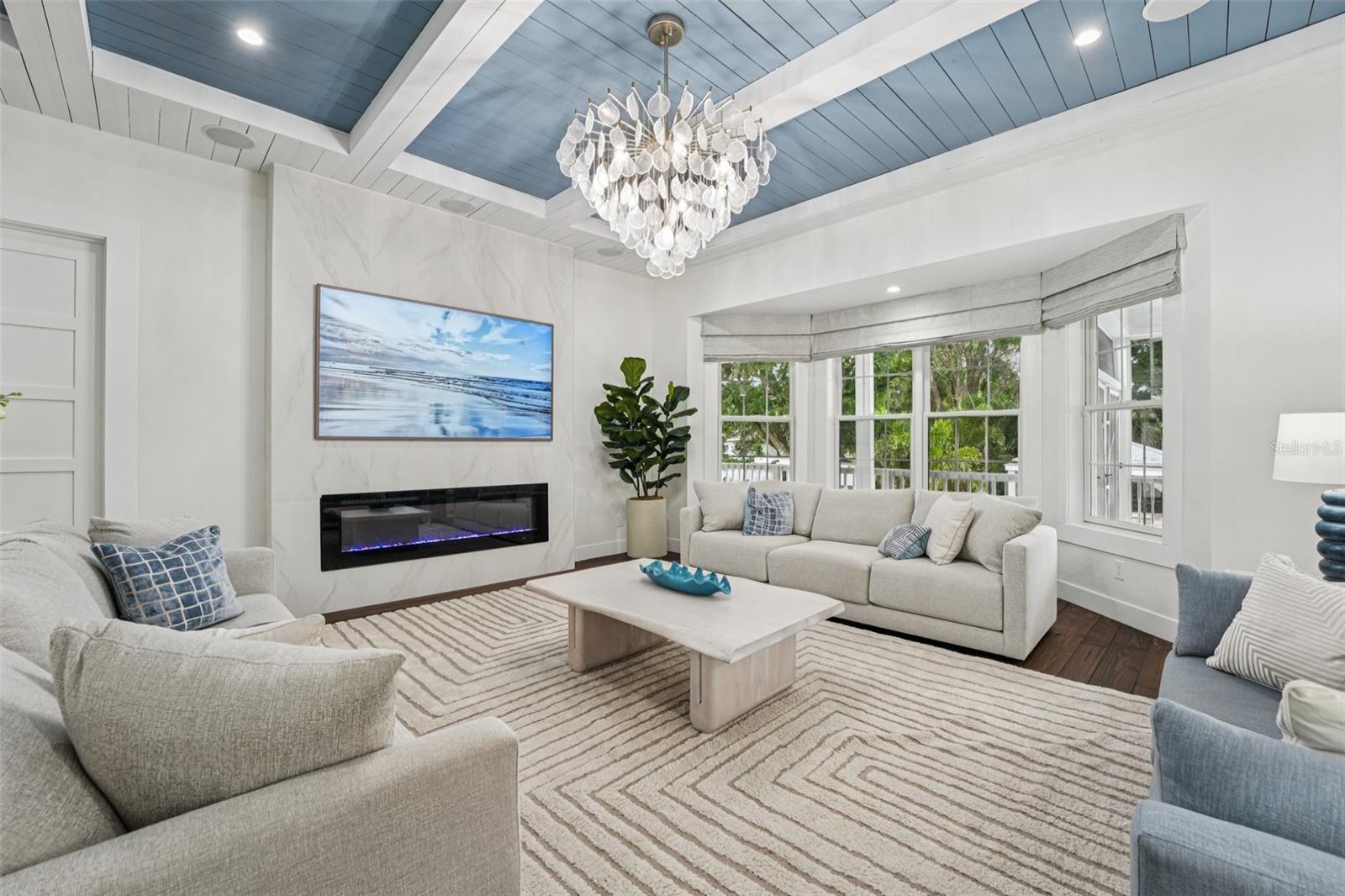 Notice the beautiful light fixture and fresh interior paint