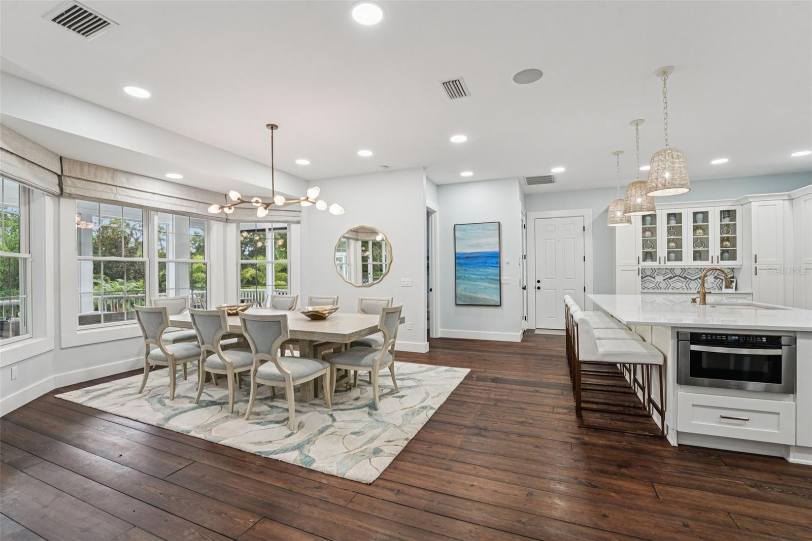 Dinning room with 1/2 bath and elevator with garage entry